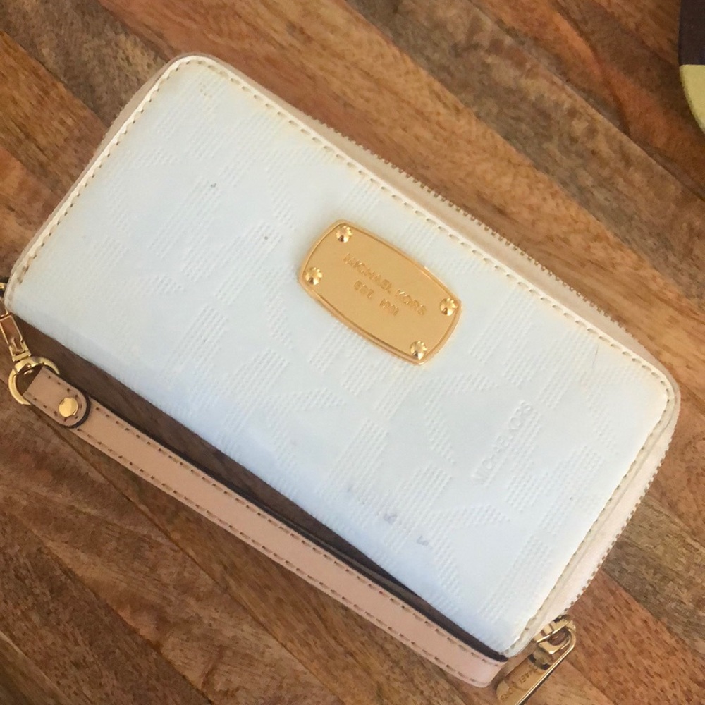 White and gold MK wristlet